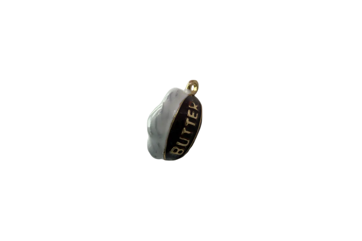 Enamel oval with gold BUTTER lettering, black and white