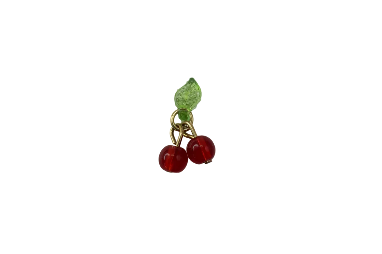 Translucent red cherries with green leaf and polished gold finish