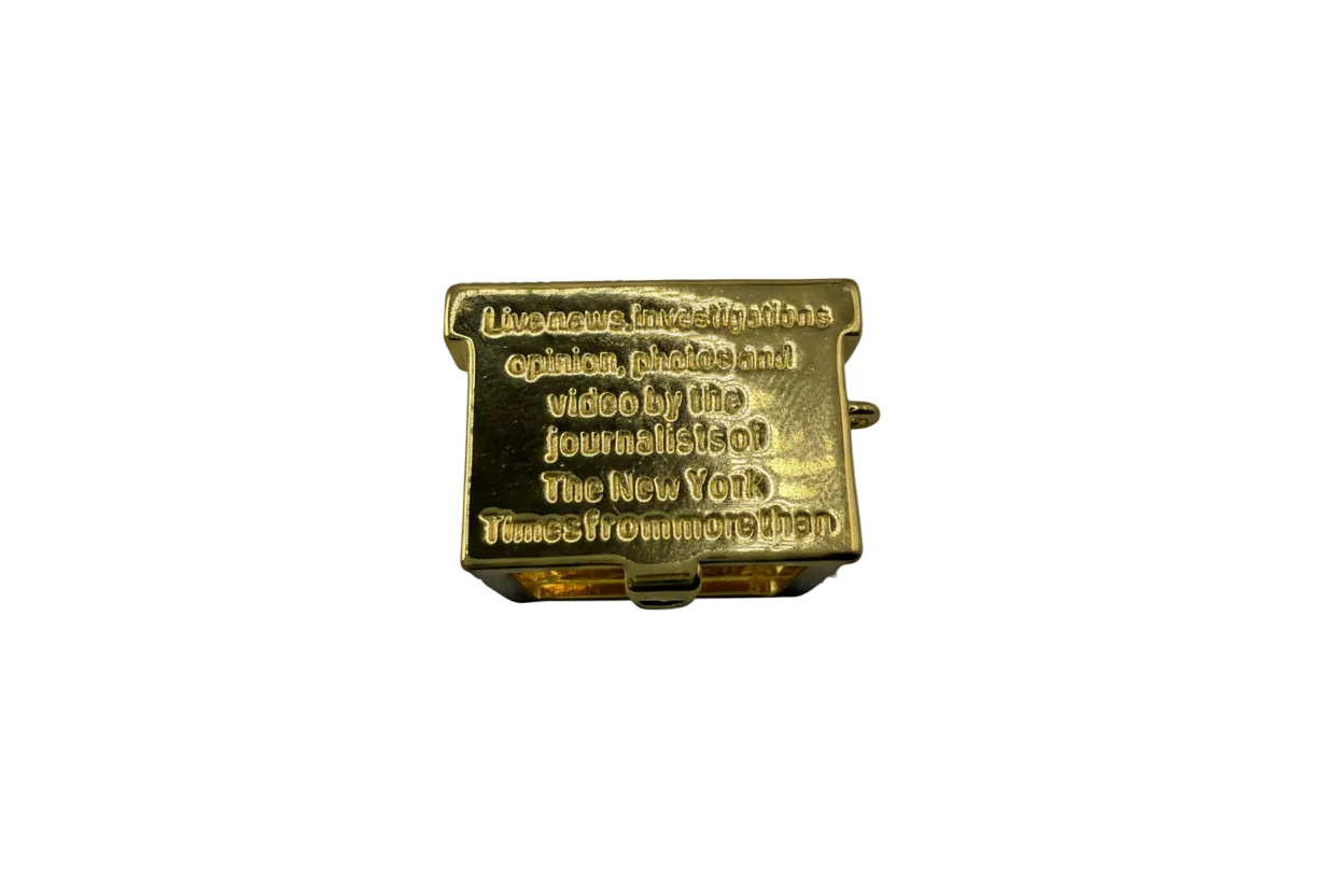 Gold rectangular plaque with raised text