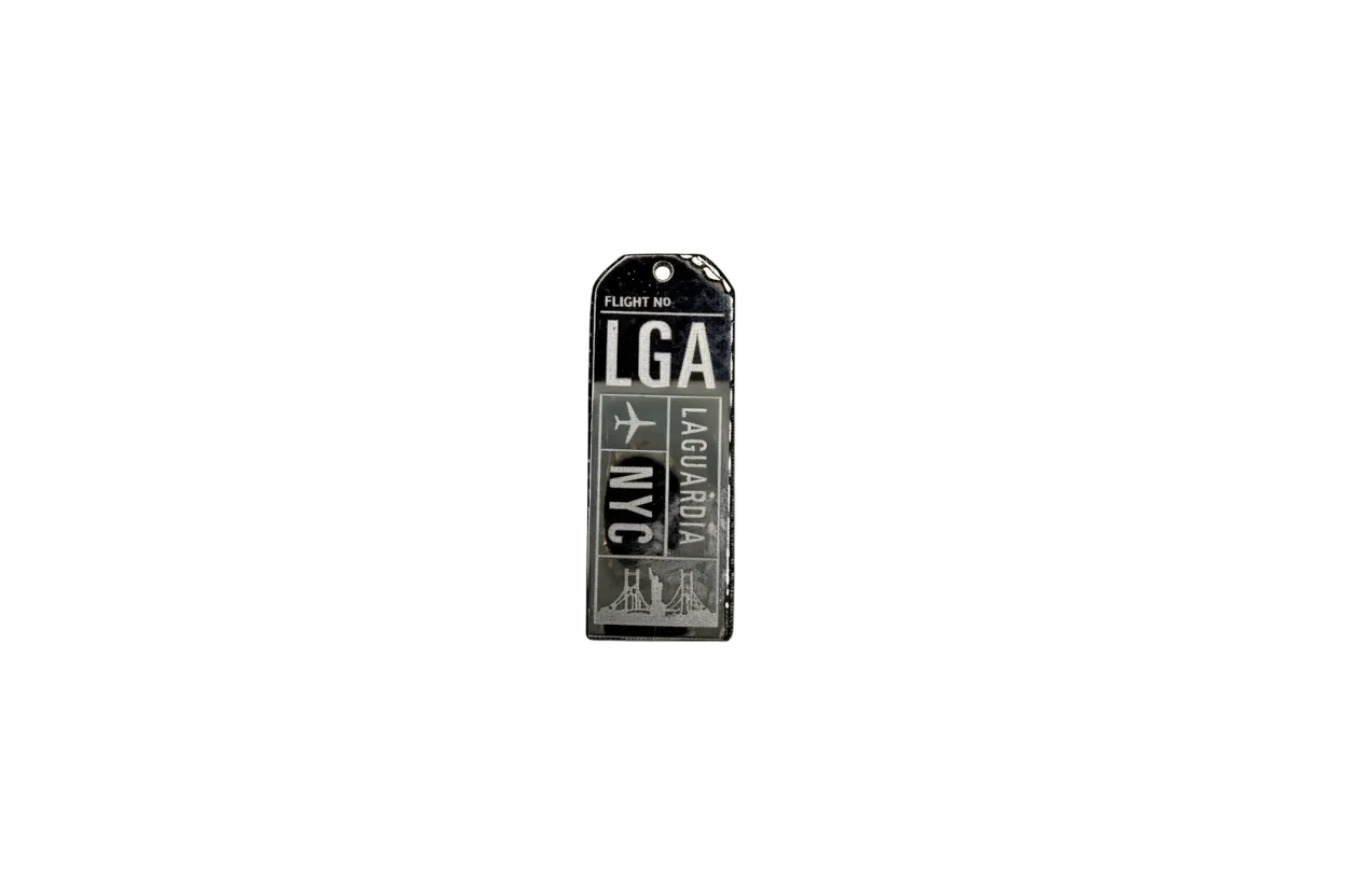 Black and silver airport code ticket tag with plane icon