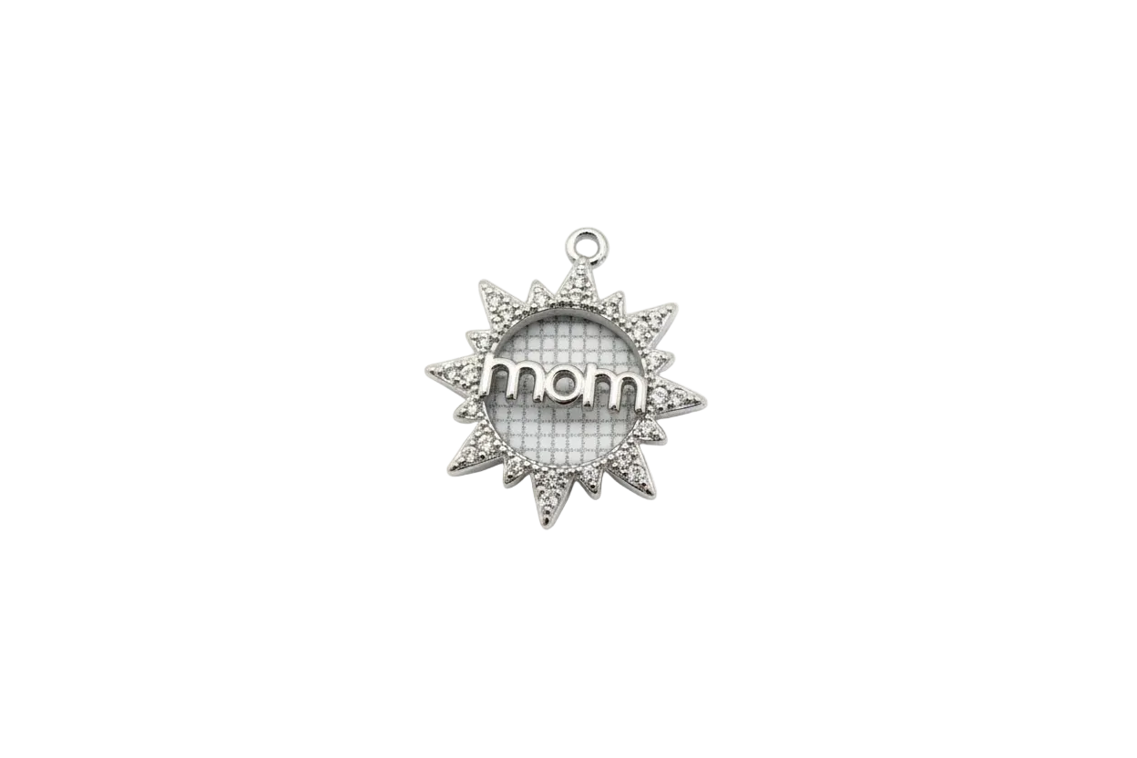 Silver sunburst “mom” medallion with clear crystals