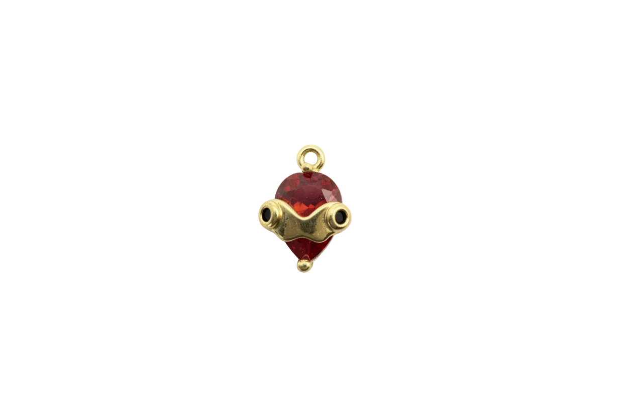 Red faceted heart gem with gold goggles