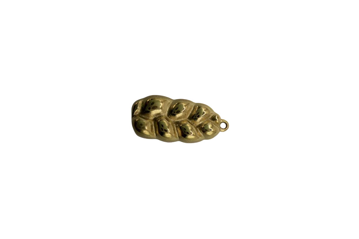 Gold cluster with green alien faces and black eyes