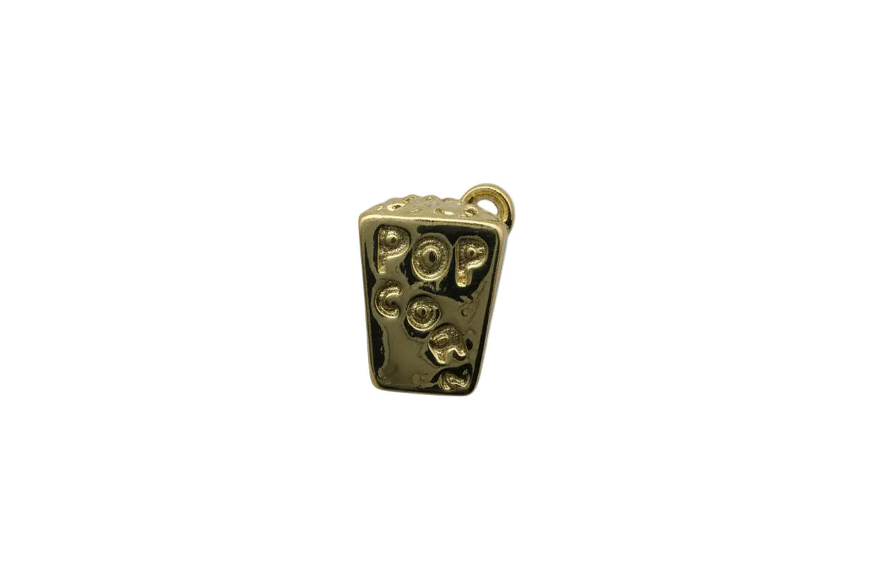 Gold candy bar charm with raised gummy-like shapes