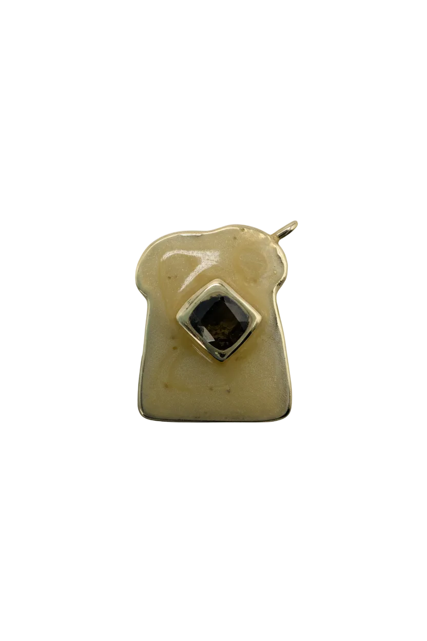 Ivory dog bone charm with gold outline and black square