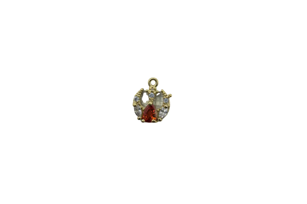 Gold crown with burnt orange teardrop gem and clear crystals