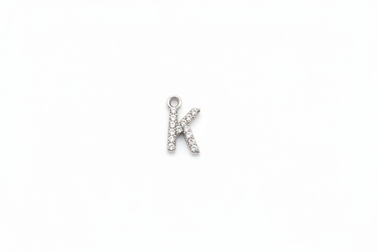 Silver initial K with clear crystals