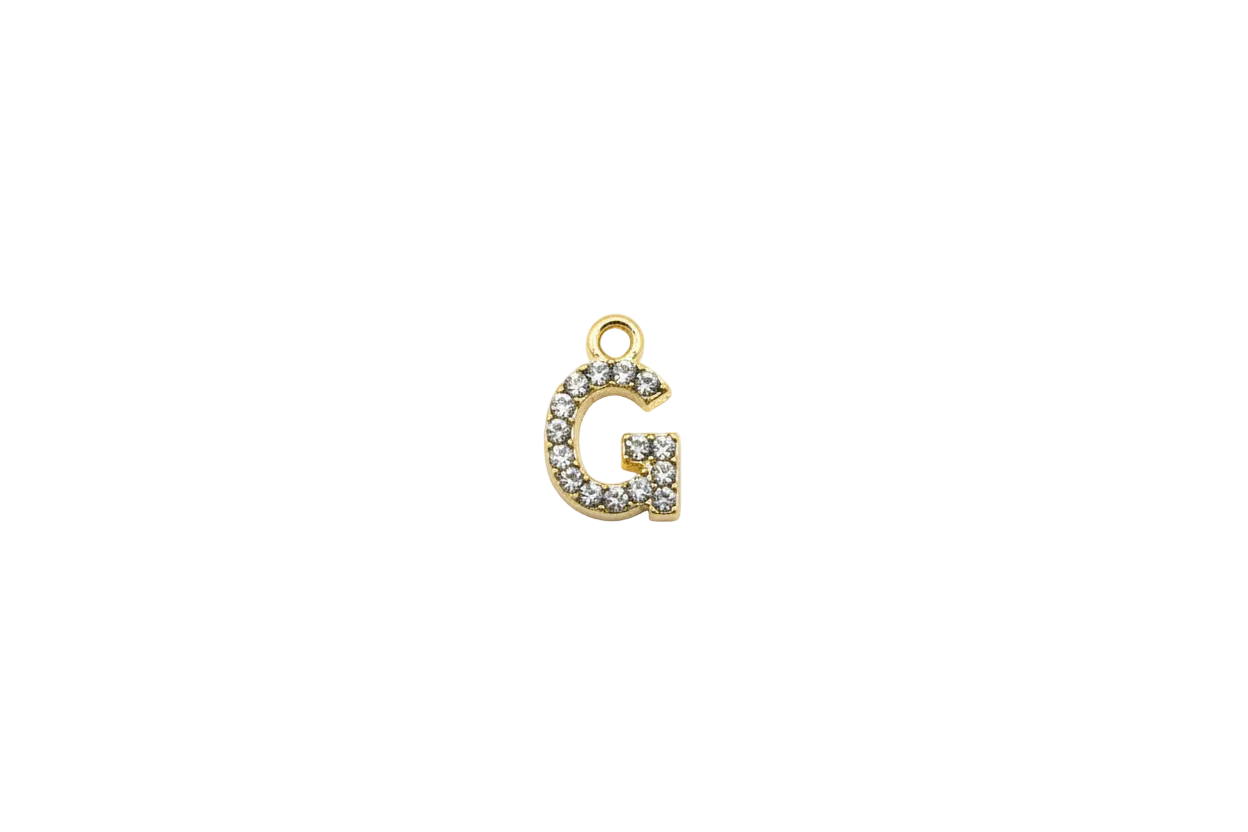 Gold initial G with clear pavé gems