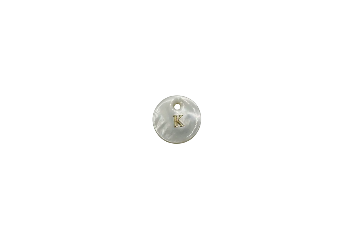 Mother-of-pearl disc with gold letter K