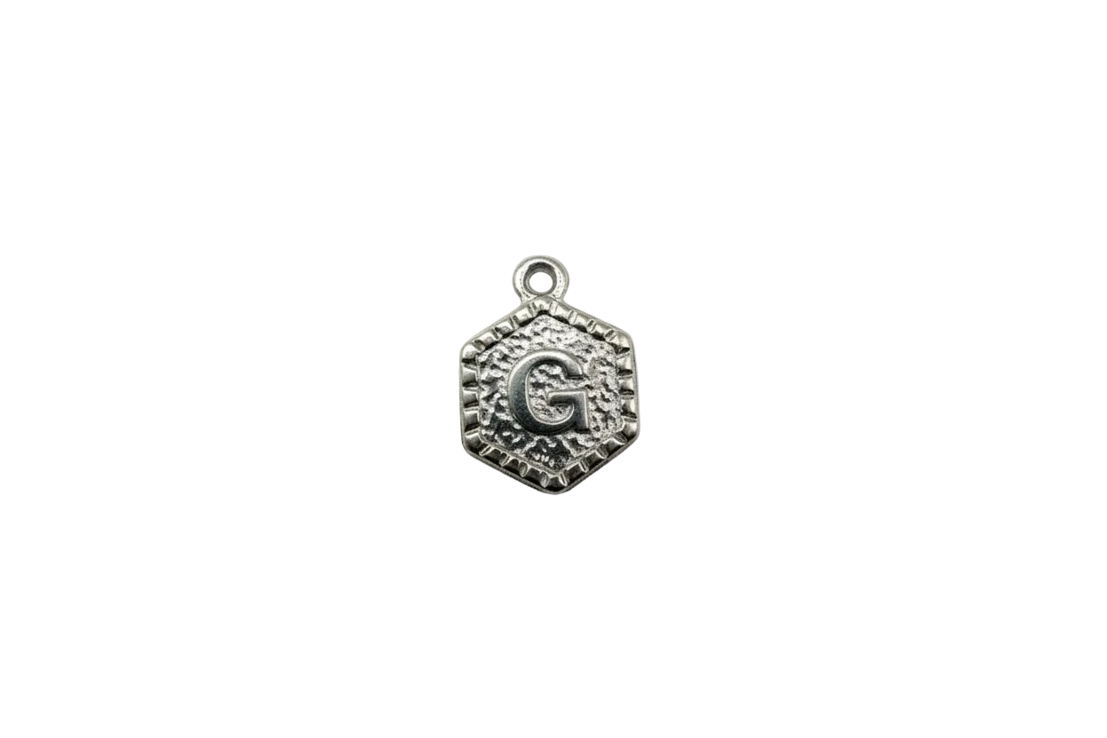 Antique silver hexagon letter G medallion