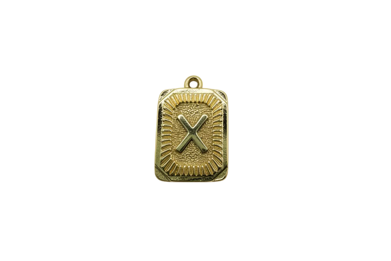Gold plaque with raised X and textured border