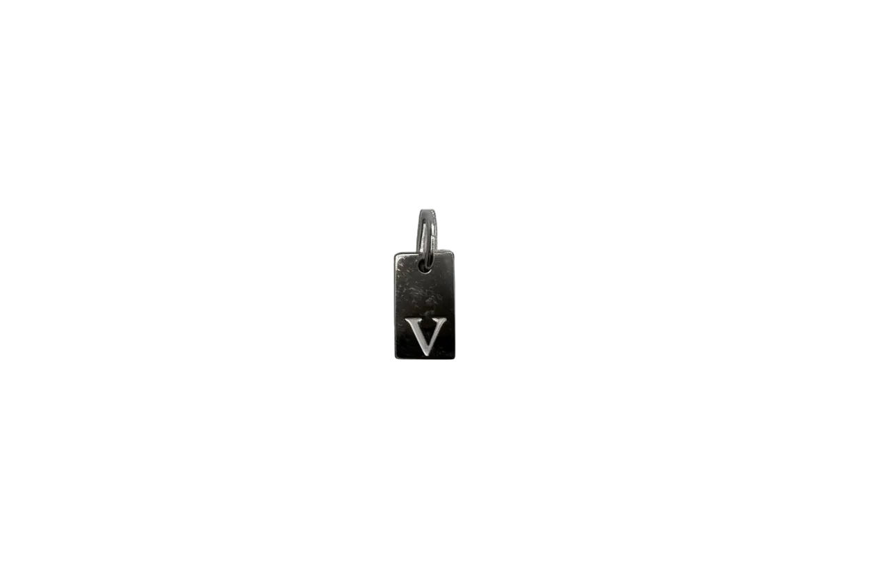 Silver rectangular tag with engraved V