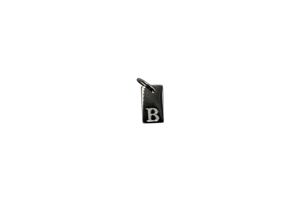 Silver rectangular tag with raised letter B