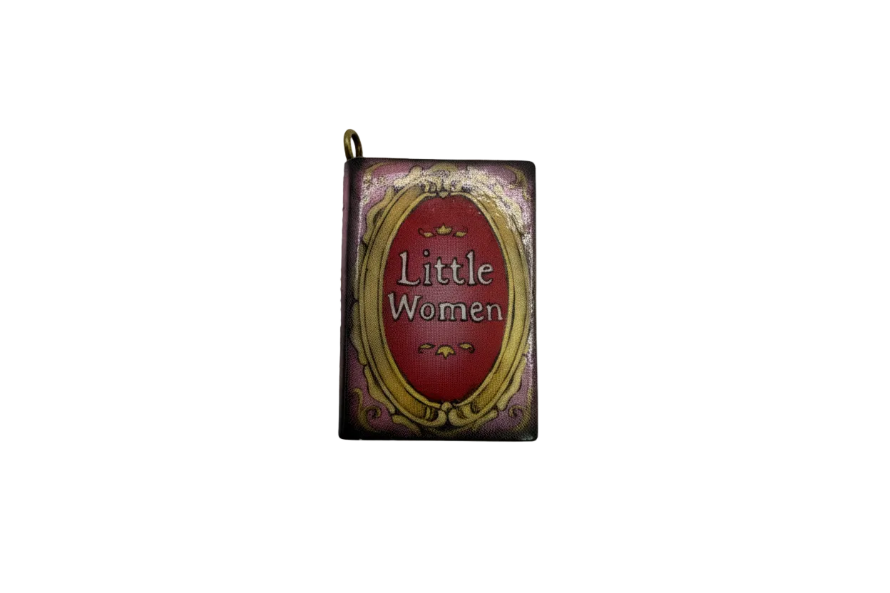 Vintage mini book with burgundy label and ornate gold frame on purple cover