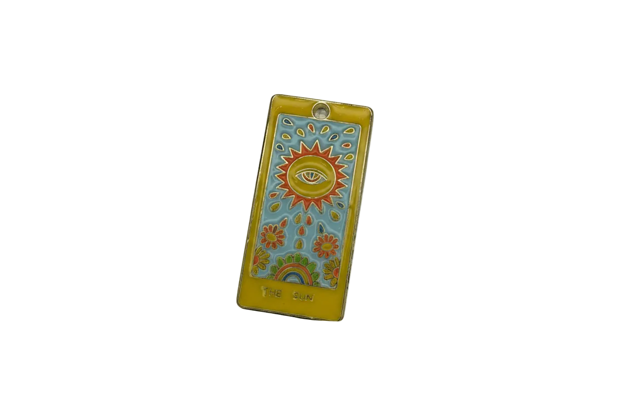 Enamel sun-and-eye tarot card with flowers and rainbow, gold edged