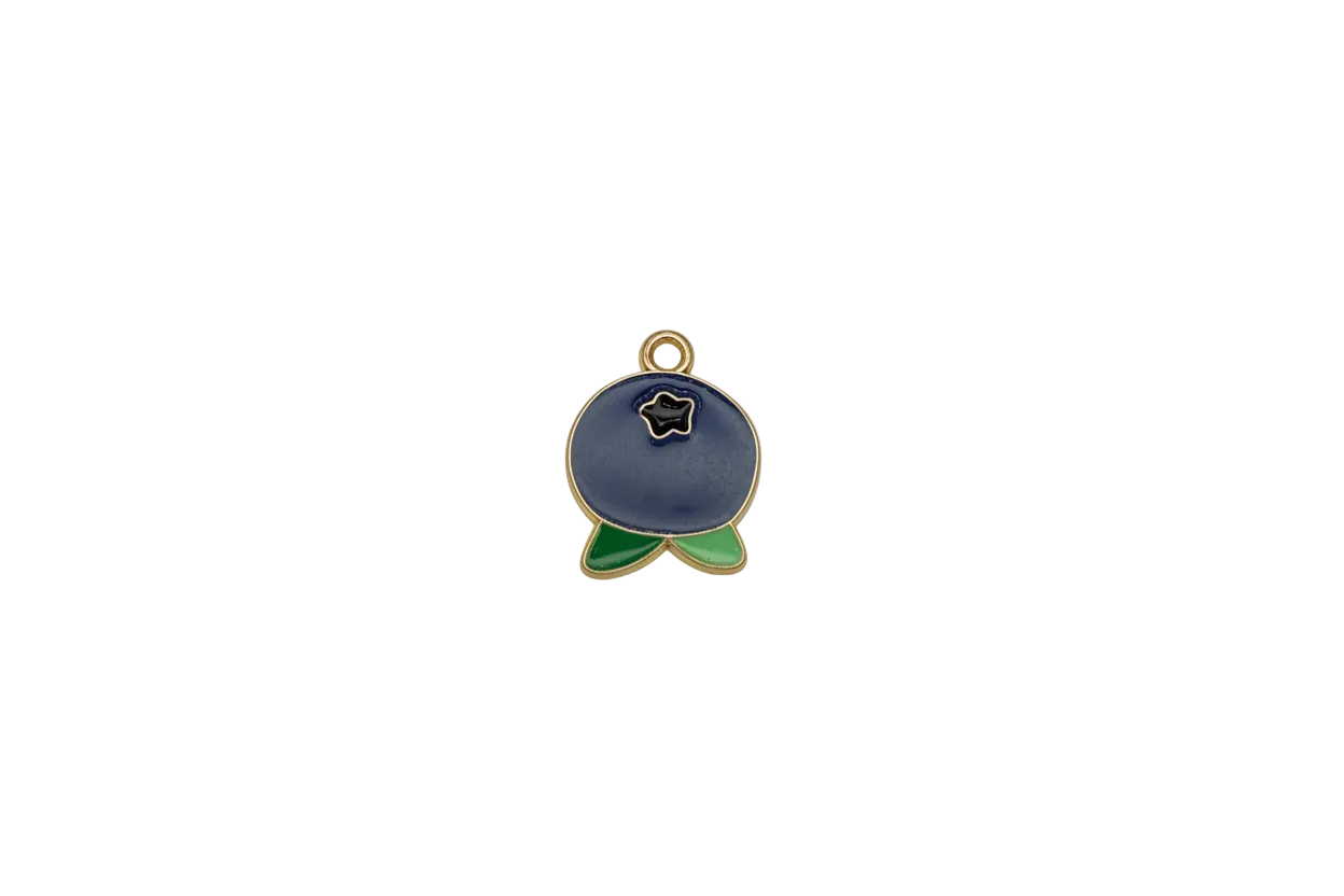 Navy enamel whale with green tail and gold outline