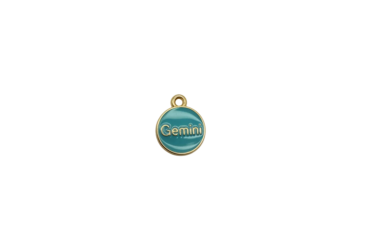 Teal Gemini round medallion with raised gold lettering