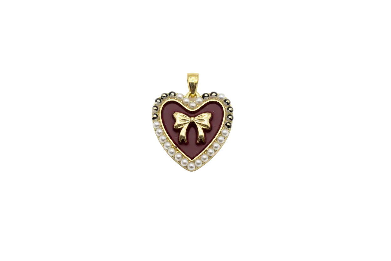 Gold heart with burgundy enamel, bow detail, and pearl trim