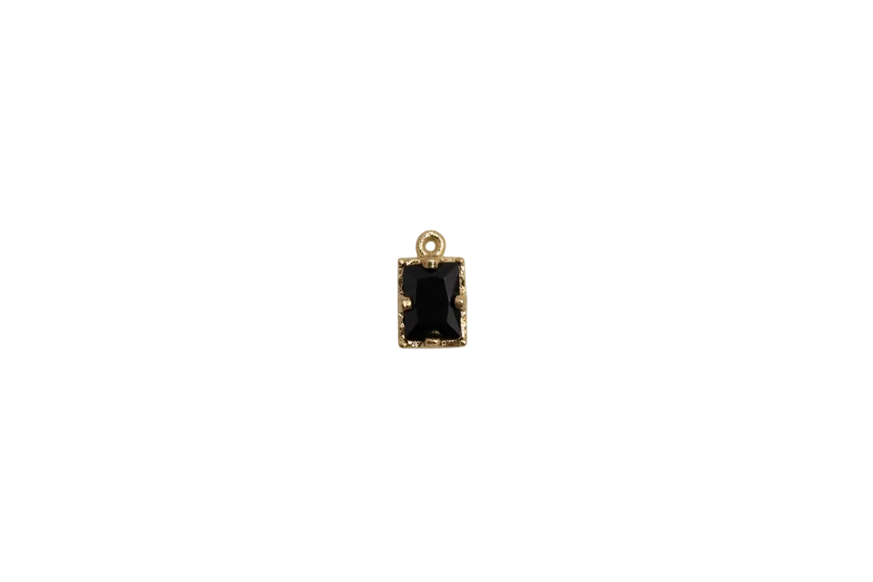 Black faceted rectangle gem in gold frame