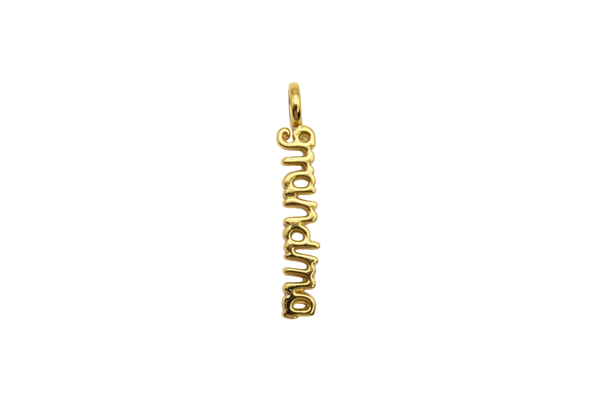 Gold script pendant spelling “dumbass”