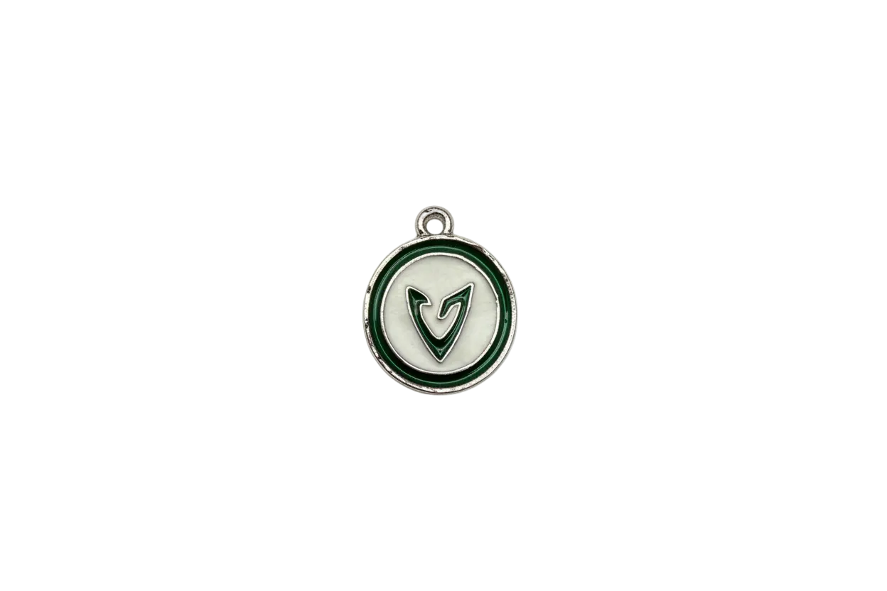 Silver-tone round medallion with green border and letter V
