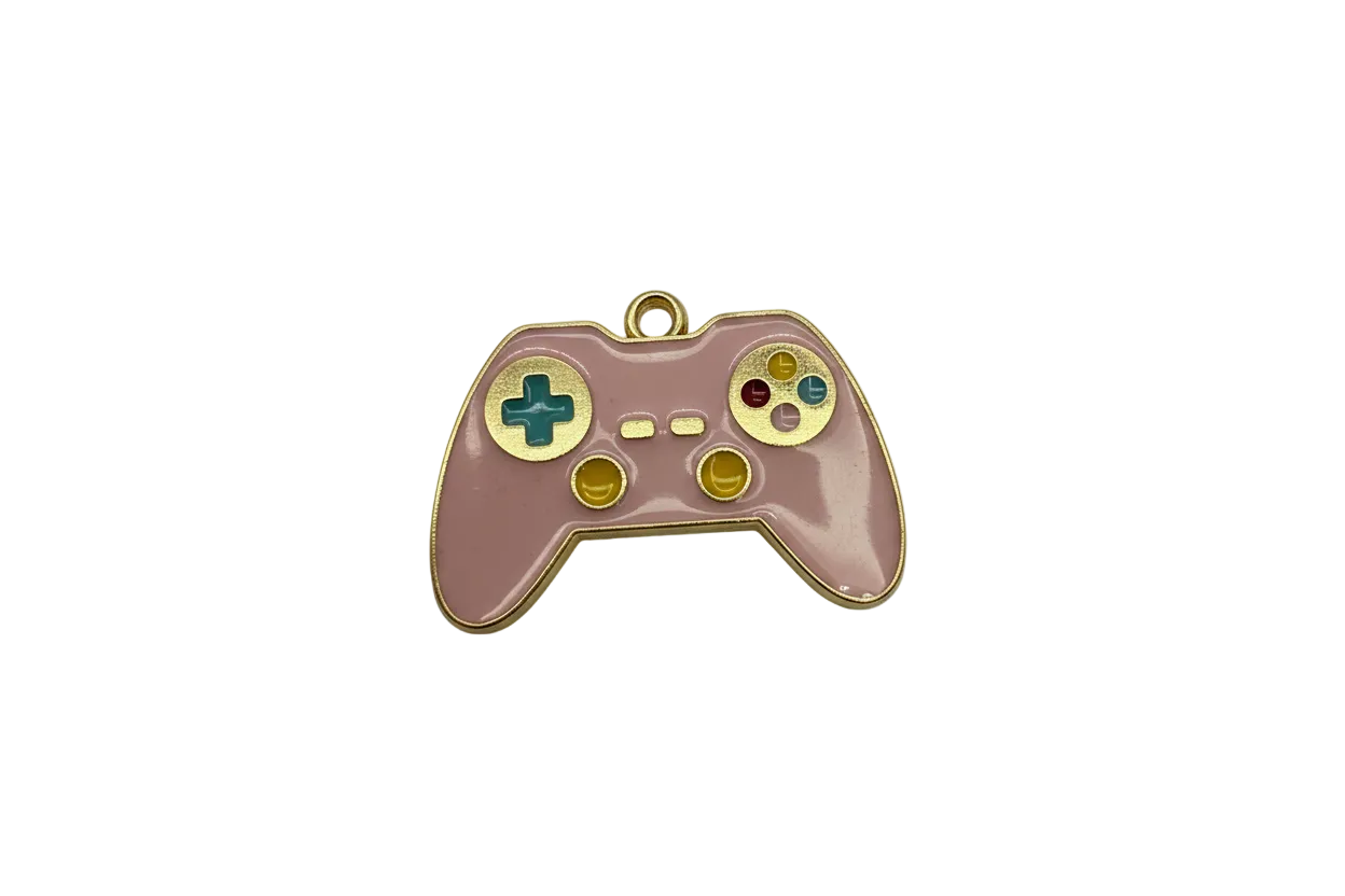 Pink enamel game controller with gold outline and multicolor buttons