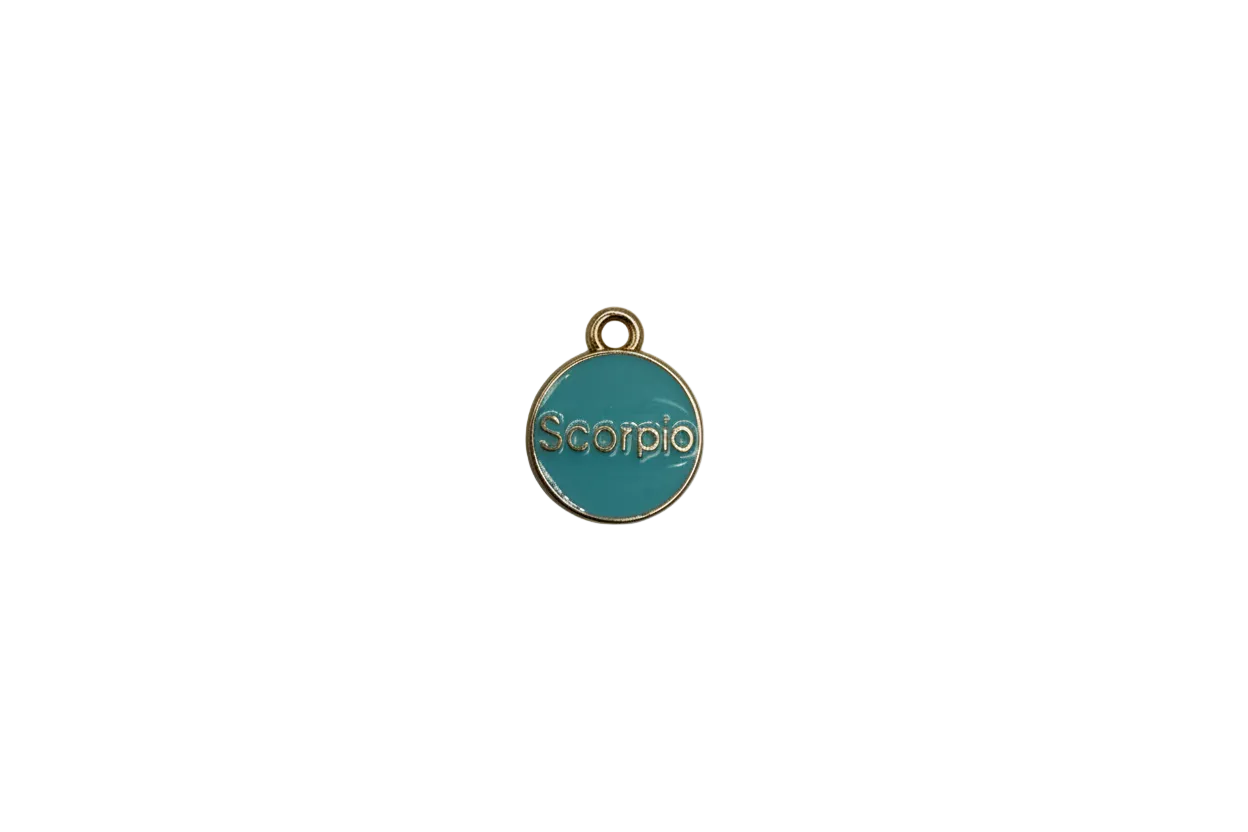 Teal Scorpio zodiac disc in gold with clear gem accent