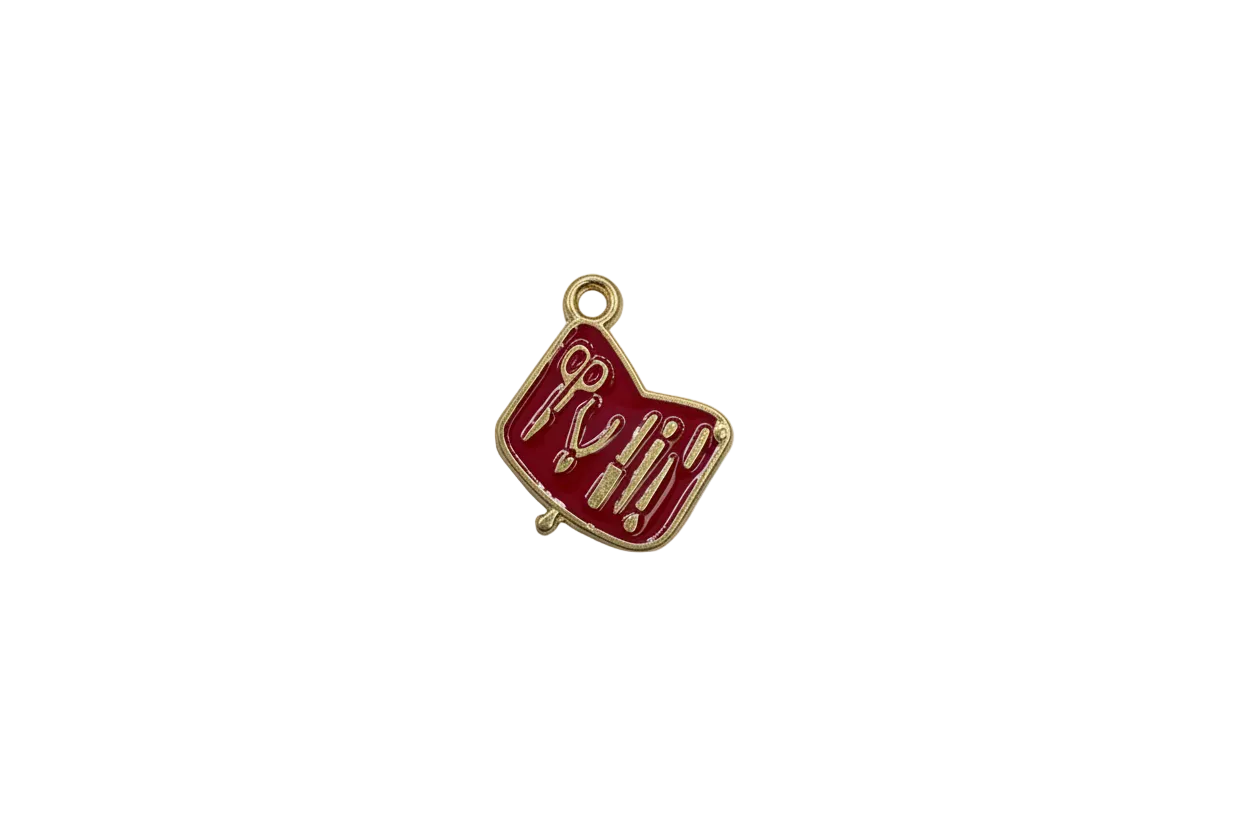 Red enamel manicure tools tag with gold details
