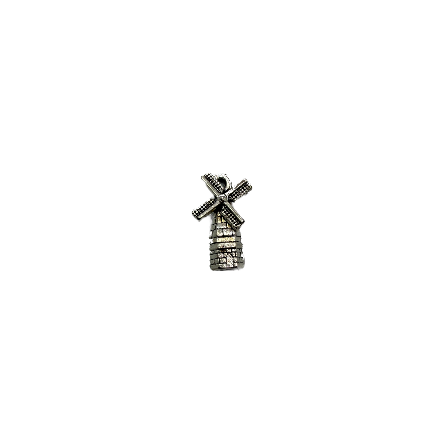Antique silver windmill tower with dotted blades