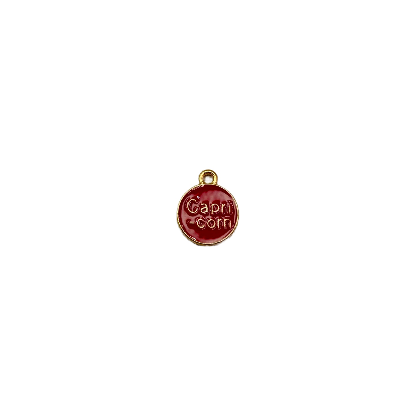 Red enamel Capricorn coin with raised gold lettering