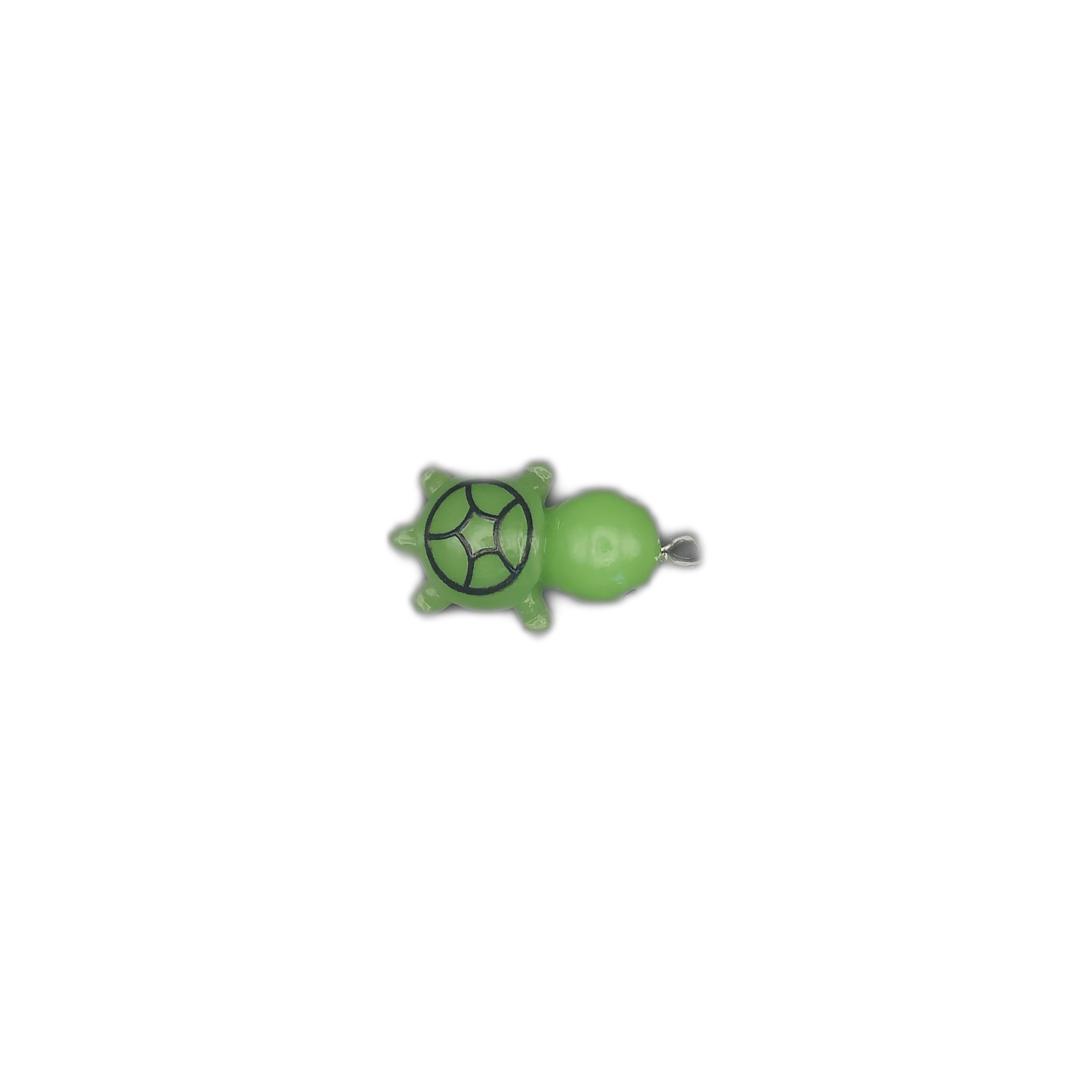 small green turtle charm centered on a black background