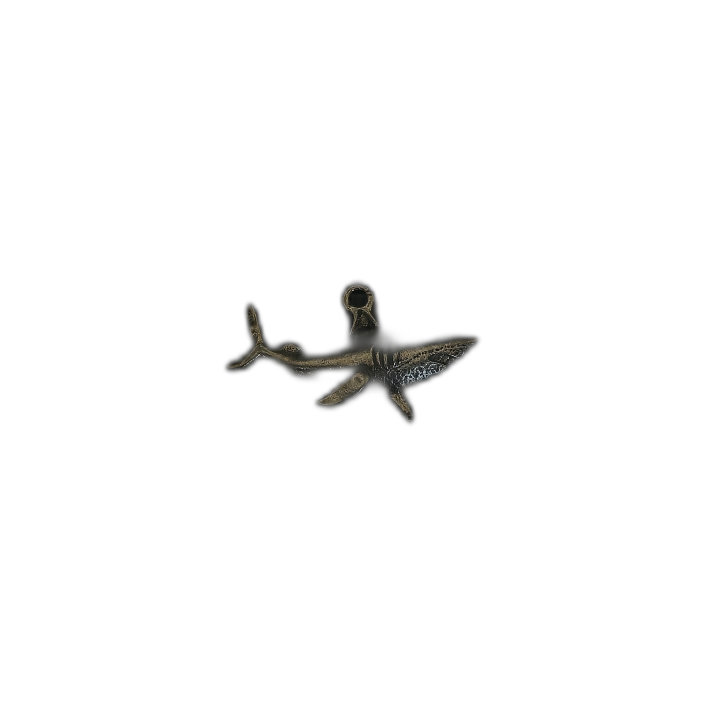 small bronze-tone shark charm centered on black background