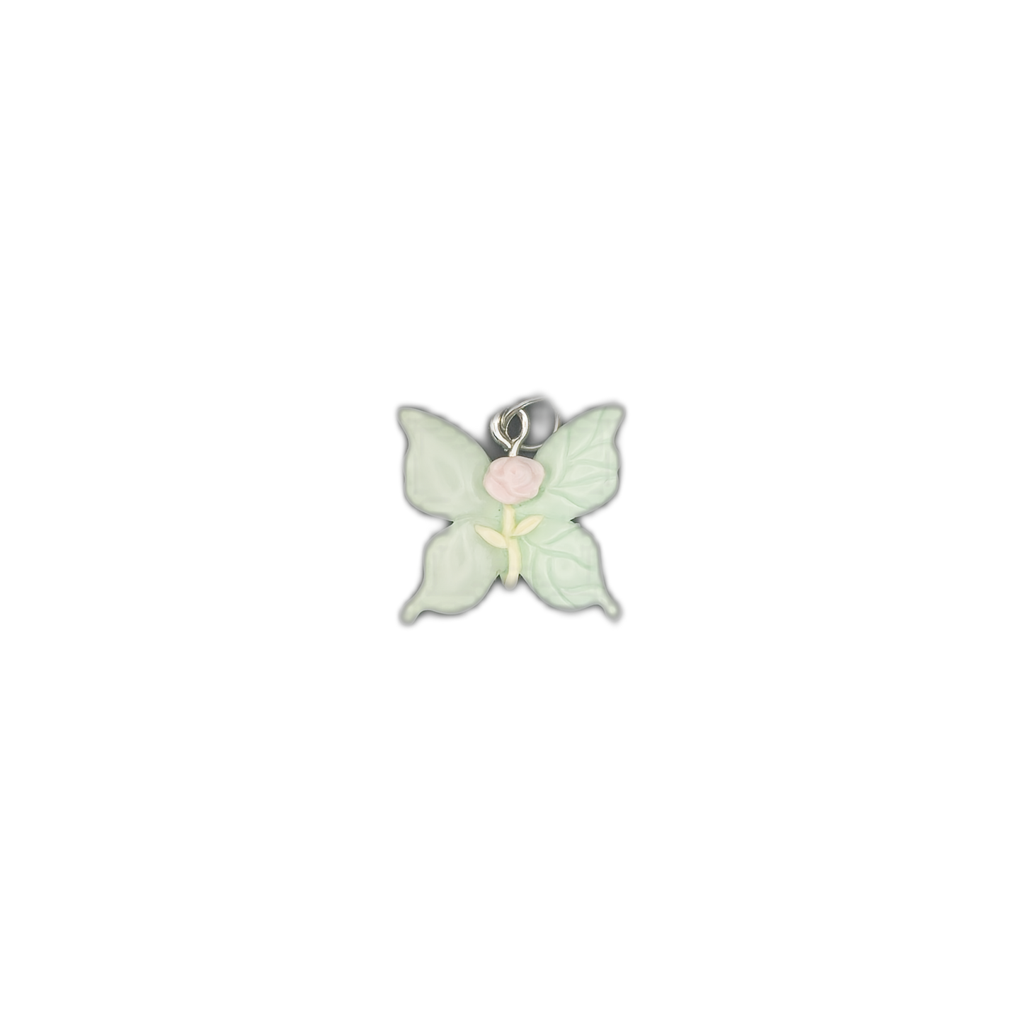 Mint green butterfly charm with a pink rose and pale yellow stem centered on a black background.