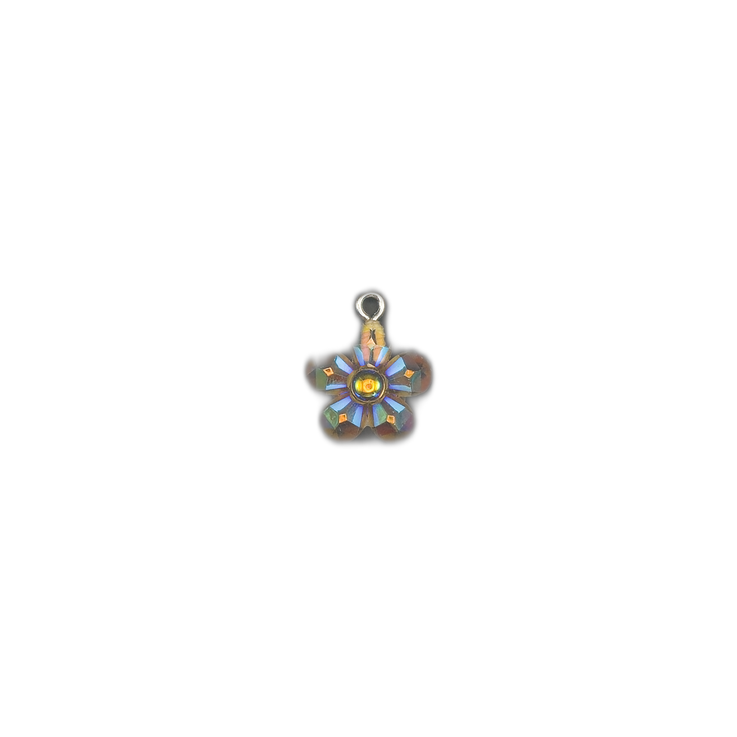 small iridescent glass flower charm centered on black background