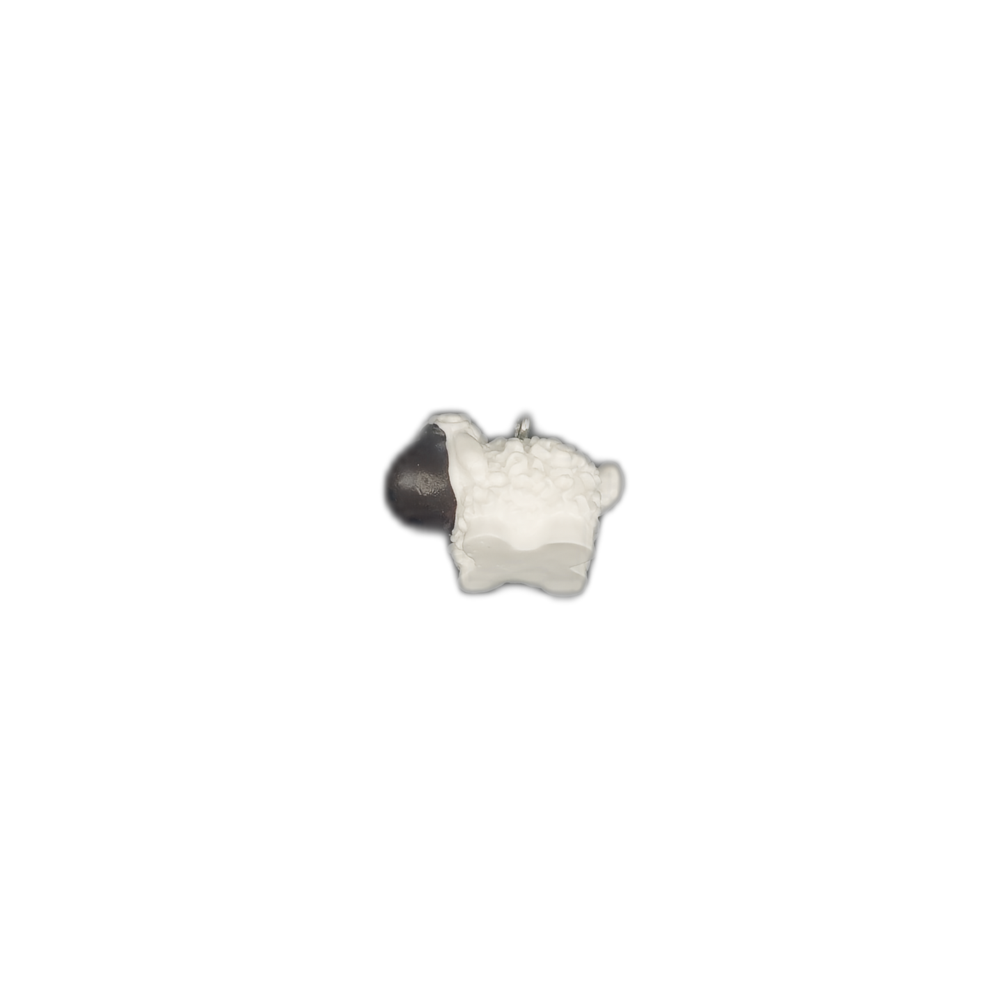 small sheep charm centered on black background