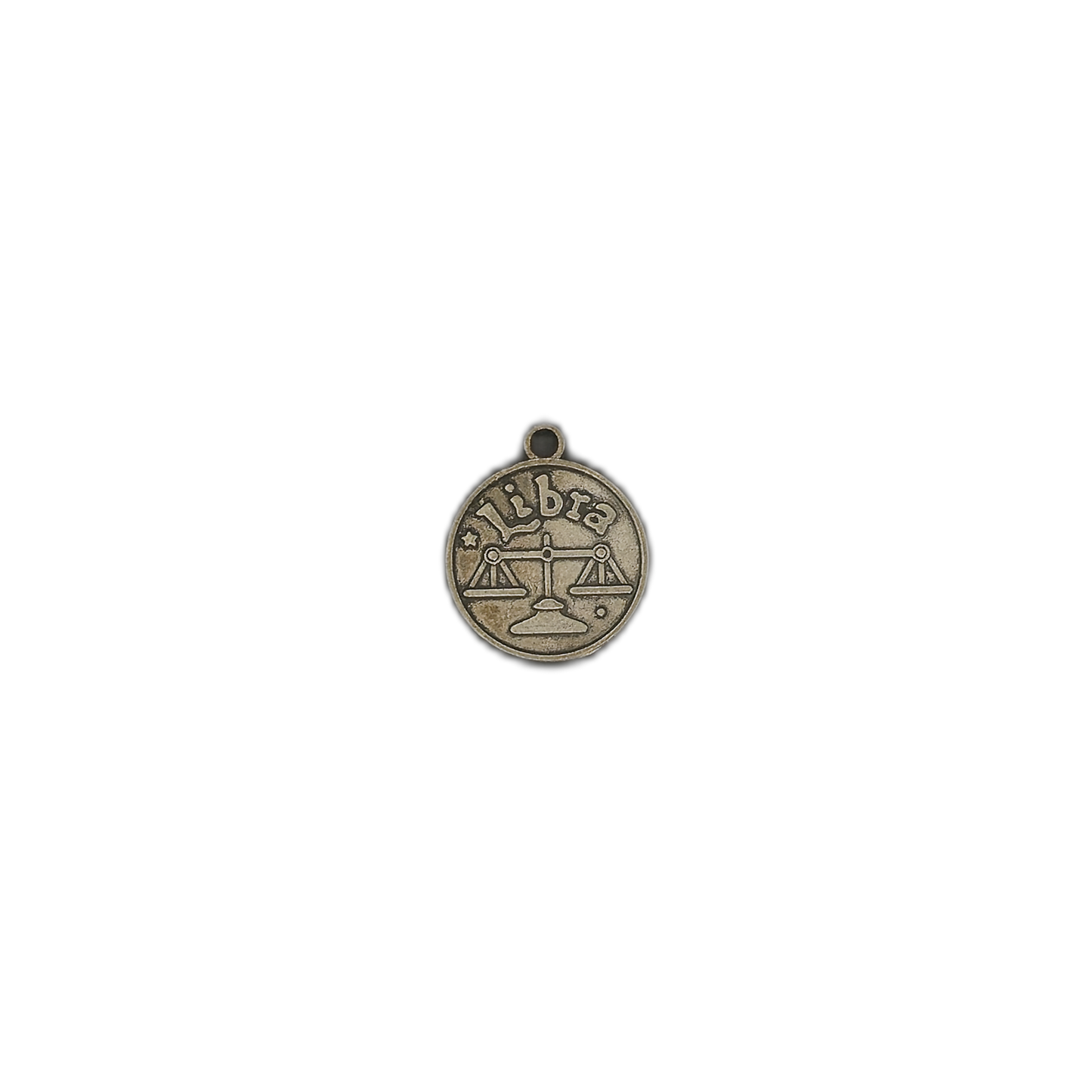 small bronze libra zodiac charm centered on black background