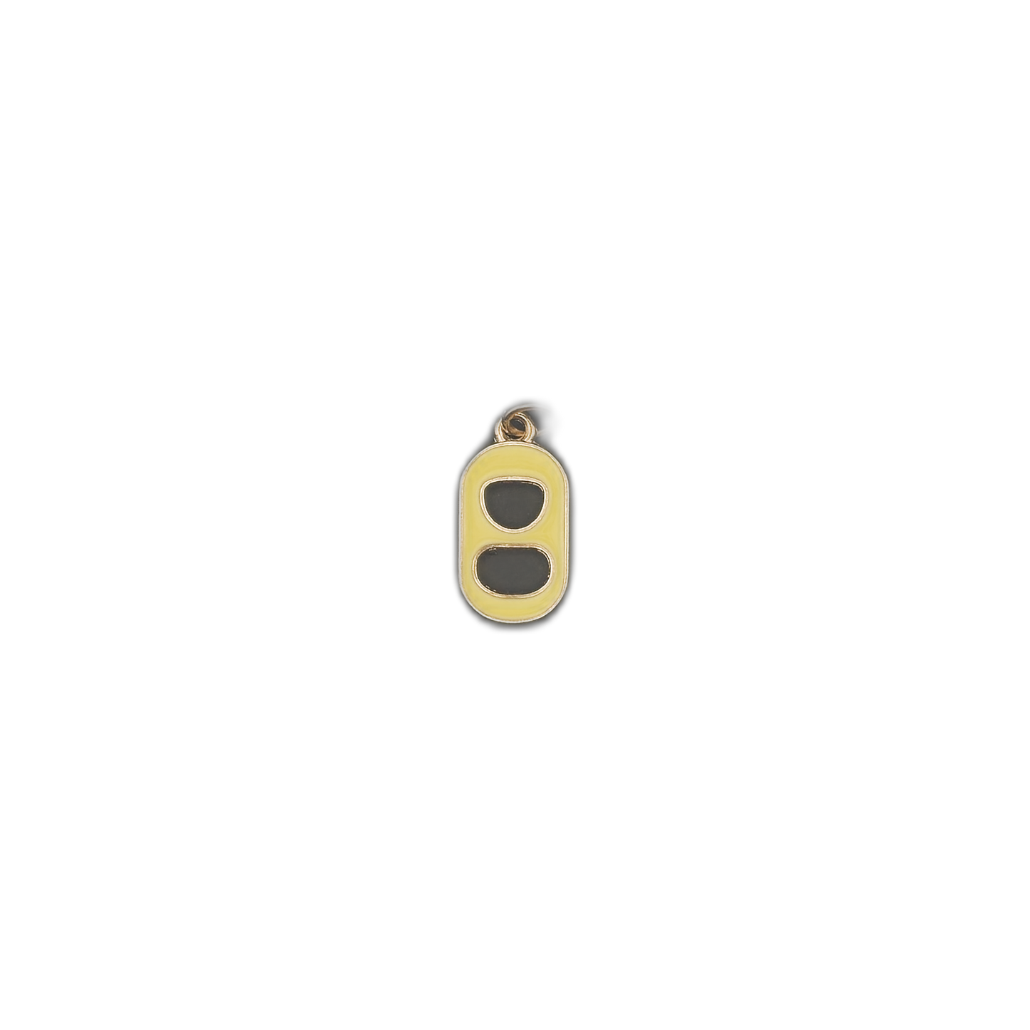 Small yellow soda tab charm centered on a black background.