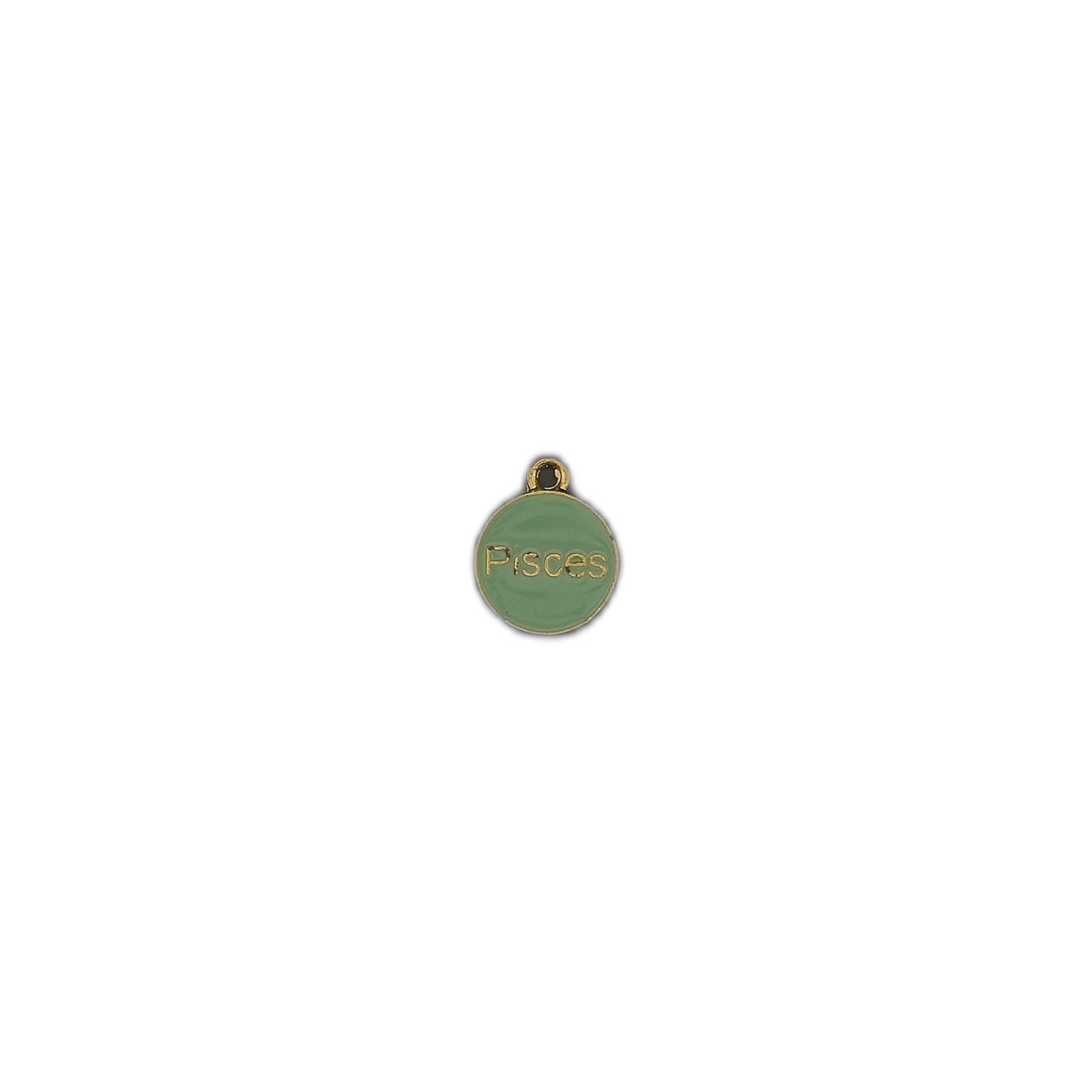 small round green Pisces charm centered on a black background