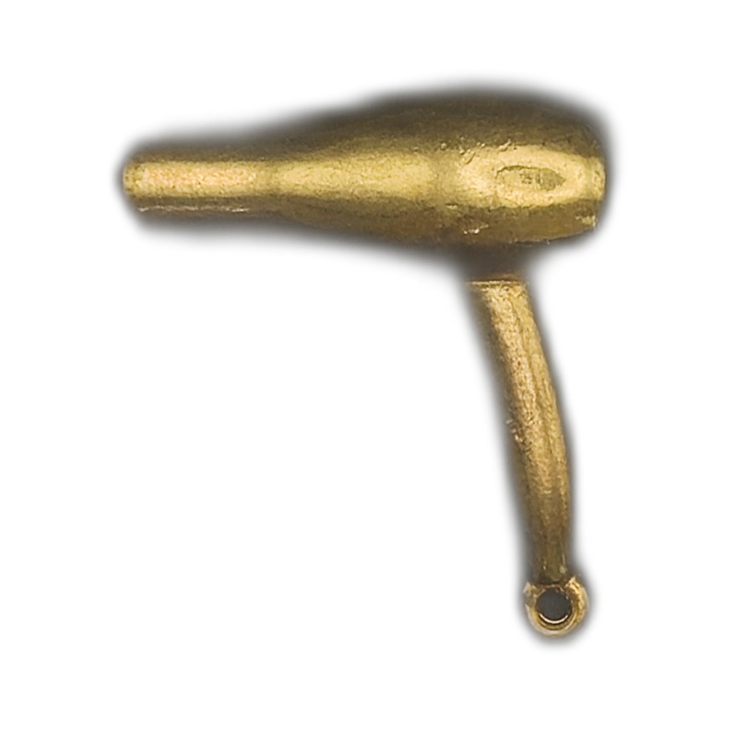 close-up of a gold-tone hair dryer charm on a black background