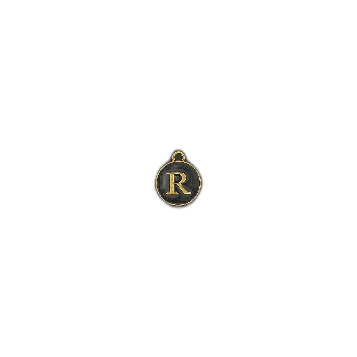 round black charm with gold letter R centered on a black background