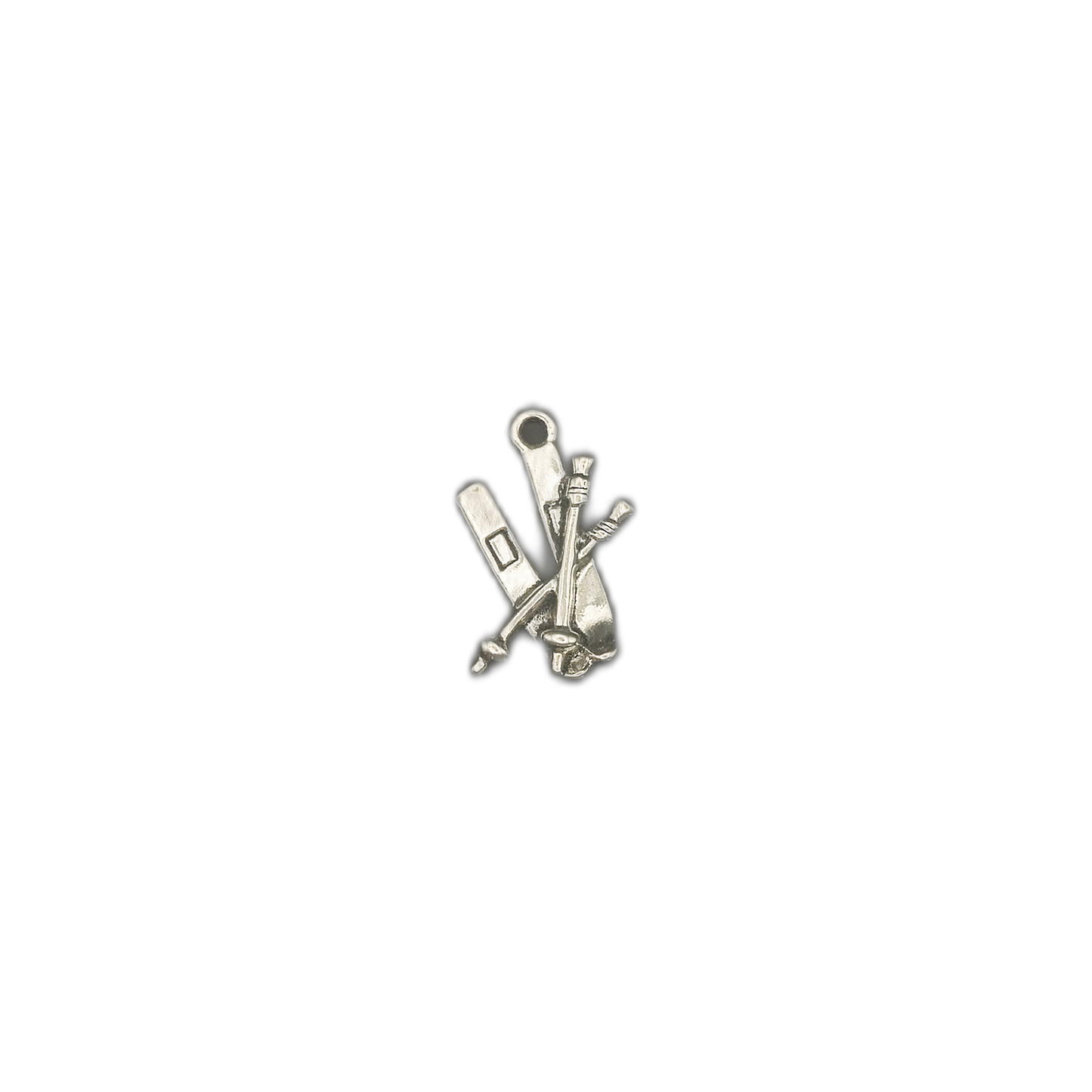 small silver ski equipment charm centered on black