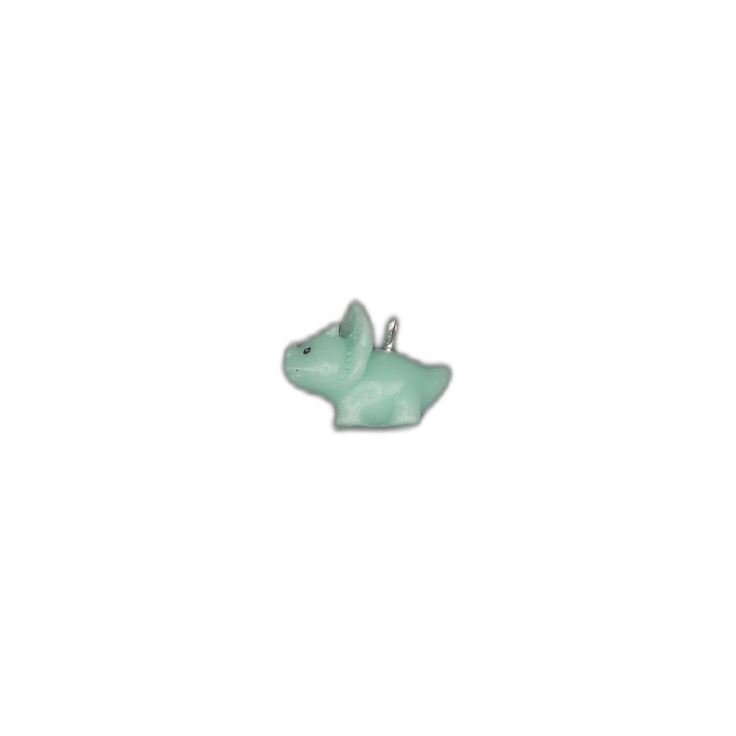 small mint green triceratops charm centered on a black background