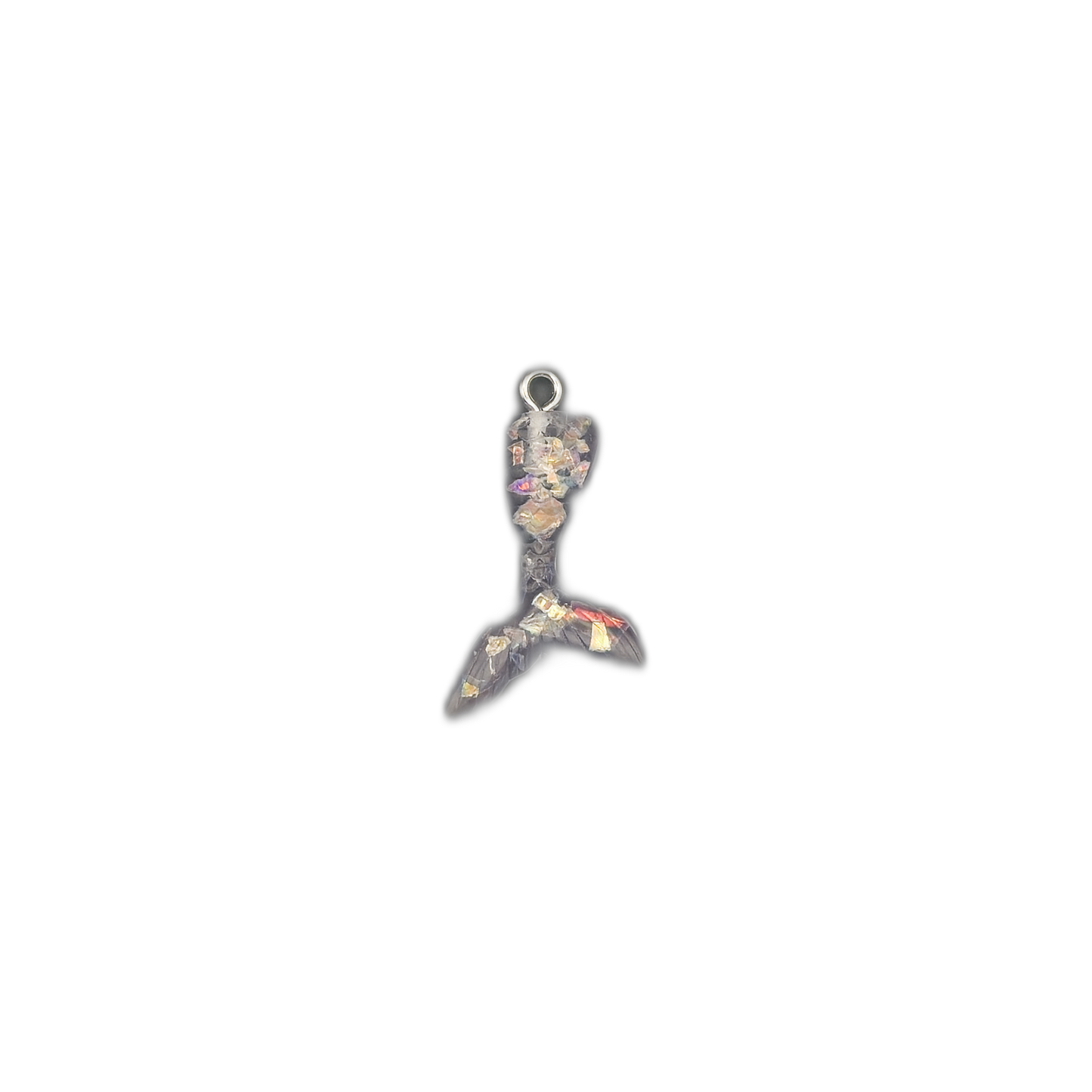 mermaid tail charm with black resin and multicolor flakes centered on black background