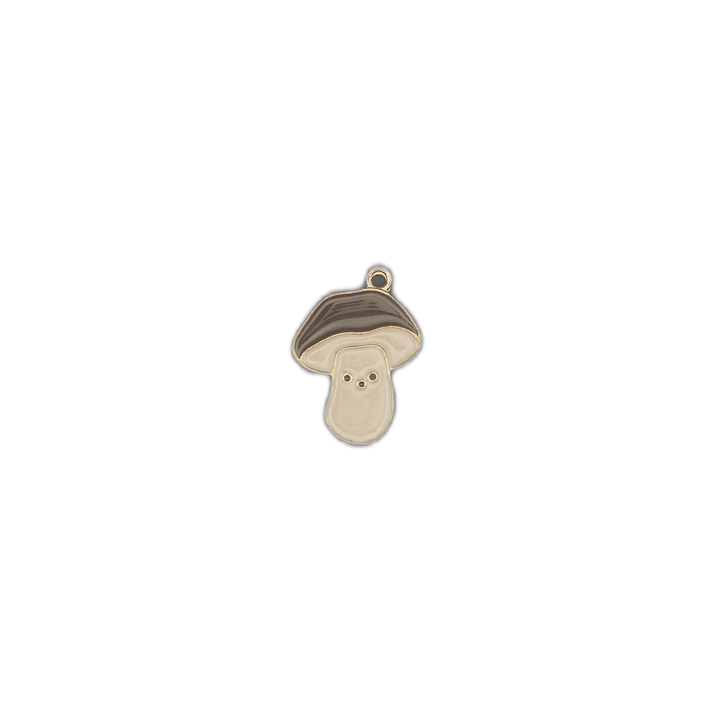 Small gold-tone enamel mushroom charm centered on a black background.