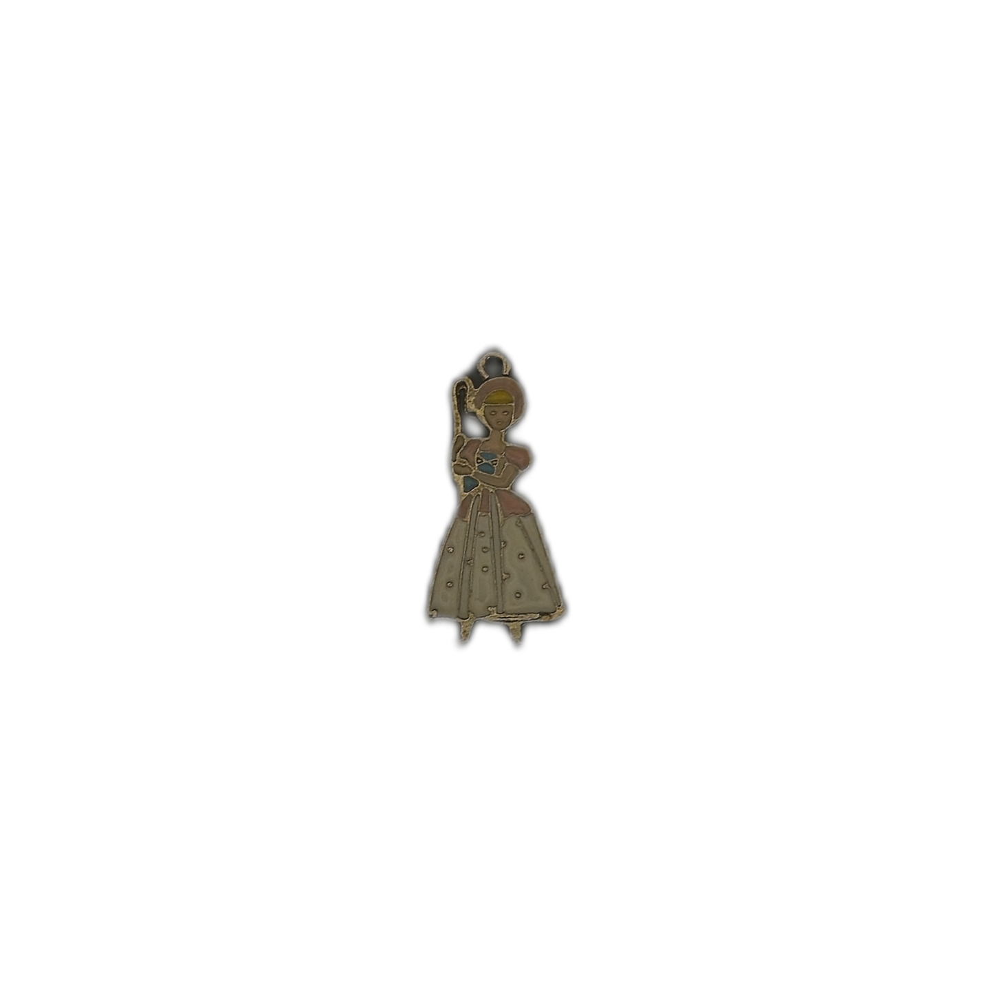 small shepherdess enamel charm centered on a black background