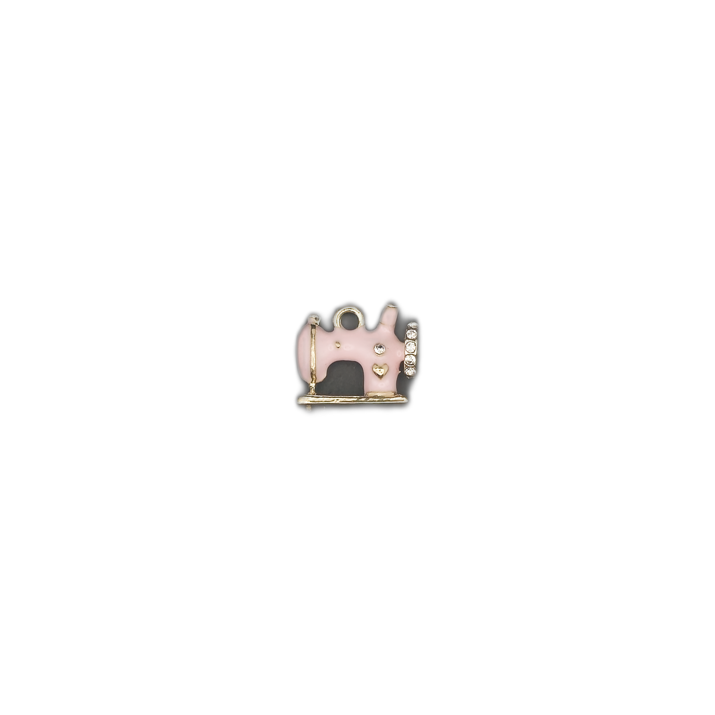 small pink sewing machine charm centered on black background