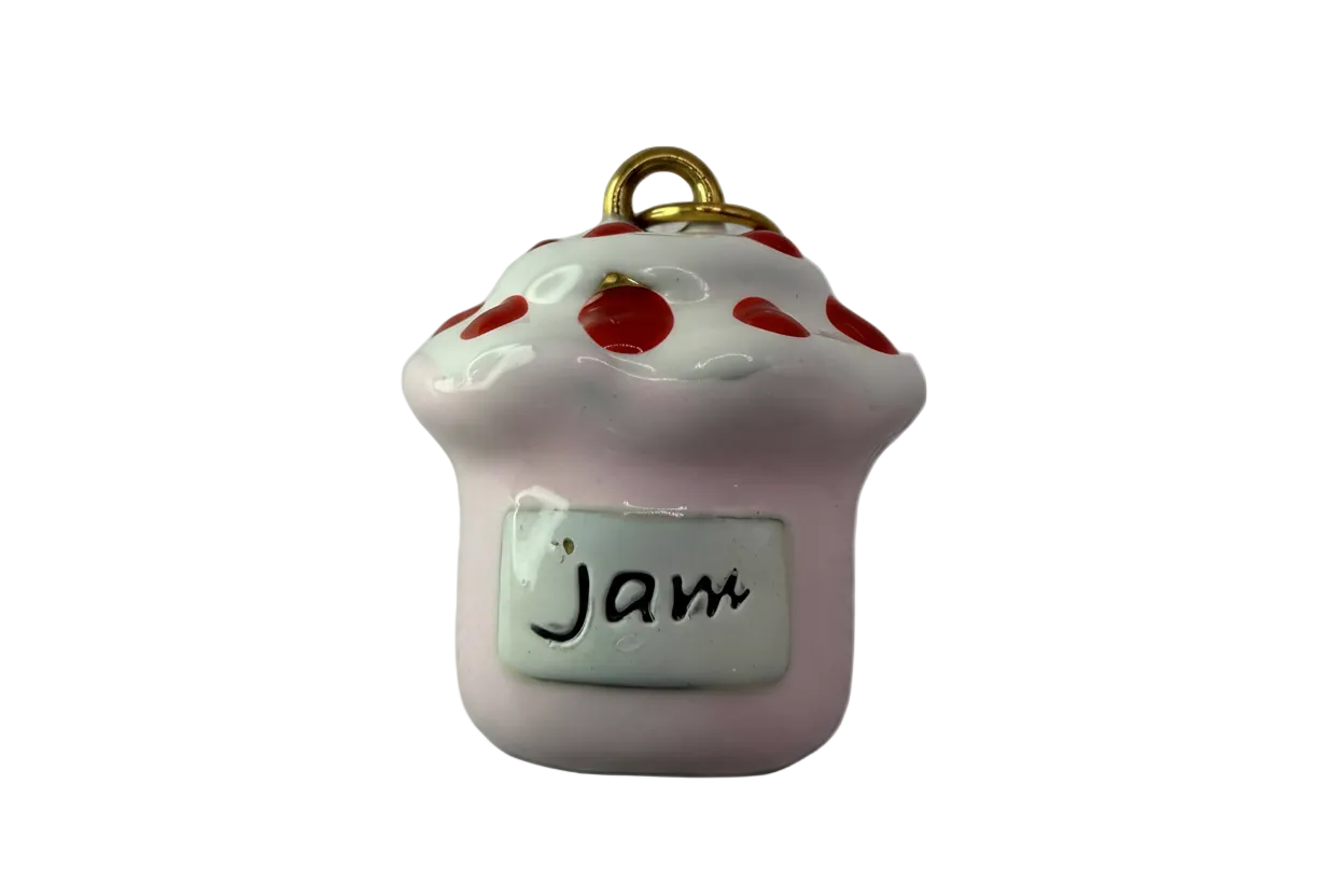 Glossy pink jam jar with white drippy lid, red dots, and a "Jam" label with gold top detail