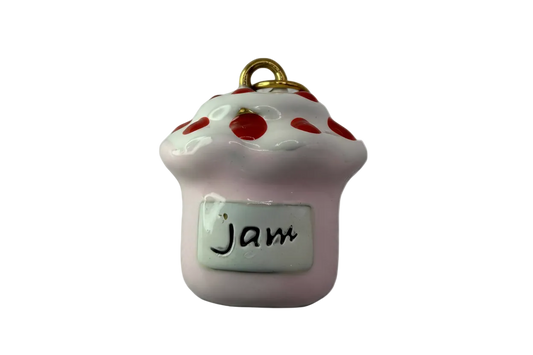 Glossy pink jam jar with white drippy lid, red dots, and a "Jam" label with gold top detail
