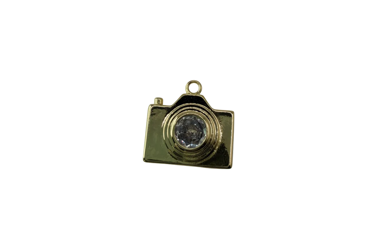 Gold camera with clear gem lens