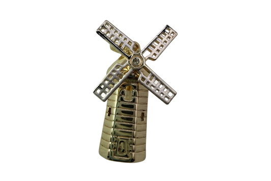 Two-tone windmill charm in polished gold with silver blades and a clear round gem center
